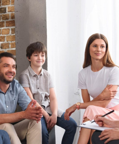 happy-family-sitting-on-therapy-session-by-female-7M4DL87-1024x684